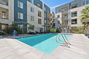 San Jose apartment for rent - A swimming pool in front of apartment buildings.
