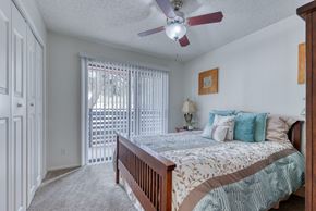 San Antonio apartment for rent - a bedroom with a bed and a ceiling fan