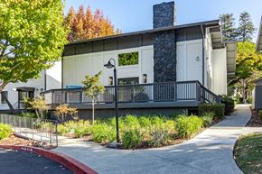 Santa Cruz apartment for rent - an exterior view of a building with a porch and a sidewalk