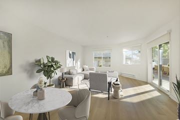 Larkspur apartment for rent - A living room with a white table and chairs.