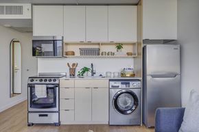 Salt Lake City apartment for rent - a kitchen with white cabinets and stainless steel appliances