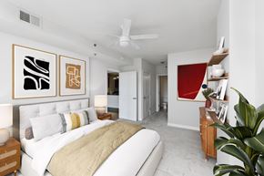 Arlington apartment for rent - A bedroom with a large bed and a painting on the wall.