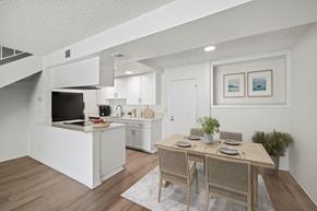 Montclair apartment for rent - A modern kitchen with a dining table set for two.