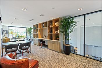 Living room with a table and chairs and a large window