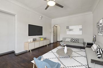 Los Angeles apartment for rent - A living room with a grey couch and a white coffee table.