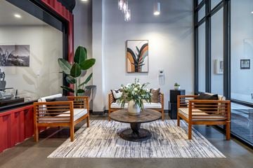Seattle apartment for rent - A modern living room with a wooden table and chairs.