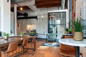 Philadelphia apartment for rent - Lobby seating area with exposed wood beams and high ceilings.