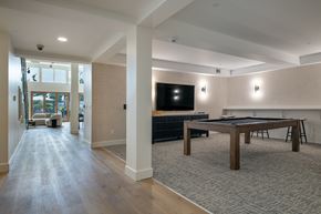 Seattle apartment for rent - A room with a pool table and a television.
