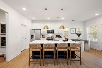 Charlotte townhouse for rent - A modern kitchen with a dining table and chairs.