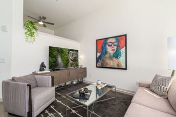 Louisville apartment for rent - A living room with a couch, chair, and a painting on the wall.