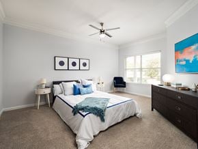 Mcdonough apartment for rent - a bedroom with a bed and a ceiling fan