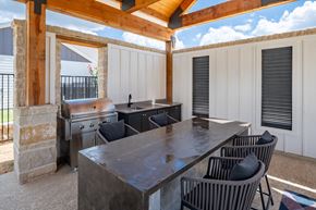Arlington apartment for rent - Outdoor kitchen with seating at Mission at Johnson Creek, Arlington, TX