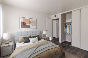 Martinez apartment for rent - A bedroom with a large bed and a painting on the wall.