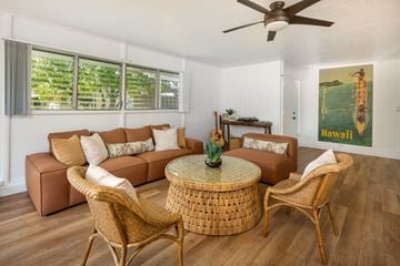 Ewa Beach apartment for rent - a living room with couches and chairs and a table