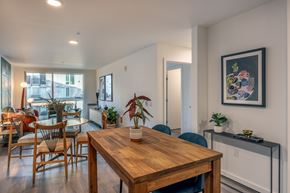 Seattle apartment for rent - A dining room with a wooden table and chairs.