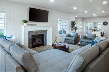 Riverton apartment for rent - A living room with a grey sofa and a fireplace.
