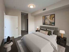San Jose apartment for rent - A bedroom with a large bed and a painting on the wall.