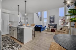 Herriman apartment for rent - A modern kitchen with a dining table and chairs.