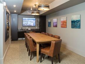 Charlotte apartment for rent - a conference room with a table and chairs and a tv