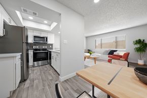 Avondale apartment for rent - Modern kitchen with dining area at Newport apartments in Avondale, AZ.