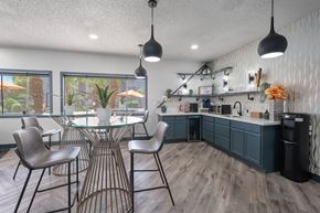 Avondale apartment for rent - A modern dining room with a glass table and chairs.