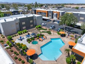 Avondale apartment for rent - Aerial view of pool with lounge chairs at Newport apartments in Avondale, AZ.