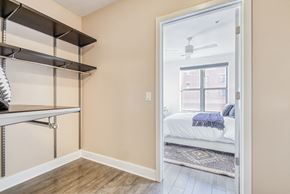 Alexandria apartment for rent - a bedroom with a bed and a closet with a mirrored door