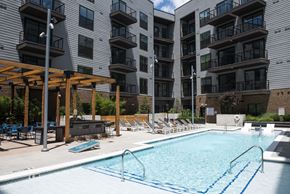 Atlanta apartment for rent - a swimming pool in front of an apartment building