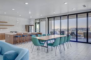 South Salt Lake apartment for rent - A modern dining room with a large table and chairs.