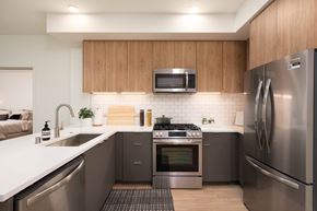 Burlingame apartment for rent - a kitchen with stainless steel appliances and a white counter top