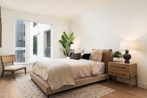 Burlingame apartment for rent - a bedroom with a bed and a window