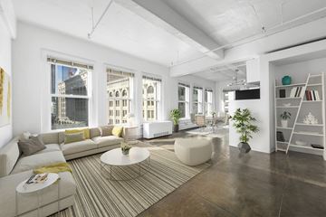 Los Angeles apartment for rent - a living room with white walls and a striped rug and a couch and a table