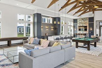 Charleston apartment for rent - A living room with a grey couch and a pool table.