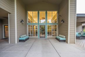 Flagstaff apartment for rent - A Building With Two Benches in Front at The Summit at Flagstaff, Flagstaff, 86004