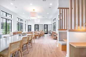 Austin apartment for rent - A modern dining room with wooden chairs and tables.