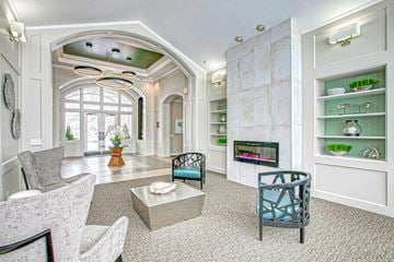 Highlands Ranch apartment for rent - A living room with a grey sofa and a fireplace.