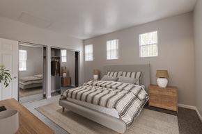 San Ramon apartment for rent - A bedroom with a large bed and a mirrored closet.