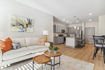 Indian Land apartment for rent - A living room with a white couch and a painting on the wall.