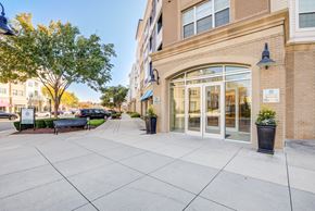 Manassas Park apartment for rent - an empty sidewalk in front of a building with glass doors