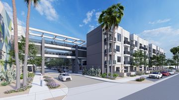 Mesa apartment for rent - A street view of a modern building with a white car driving on the road.
