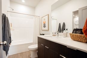 Bluffdale townhouse for rent - A bathroom with a toilet, sink, and shower.