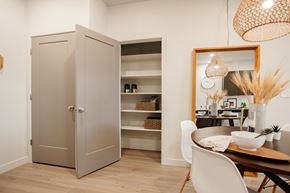 Bluffdale townhouse for rent - A kitchen with a wooden floor and a white chair.
