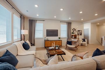 Bluffdale townhouse for rent - A living room with a white couch and a wooden coffee table.