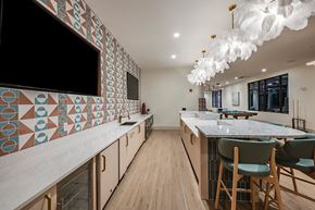 Jacksonville apartment for rent - a kitchen with marble counter tops and a table with chairs