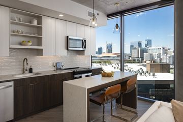Nashville apartment for rent - A modern kitchen with a view of the city skyline.