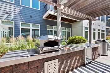 Outdoor grilling area with pizza oven