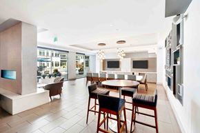 Medford apartment for rent - A modern dining area with a table set for four.