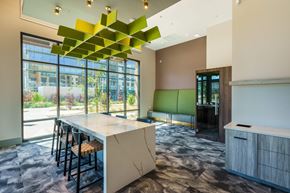 Mountain View apartment for rent - a dining room with a table and chairs and a large window
