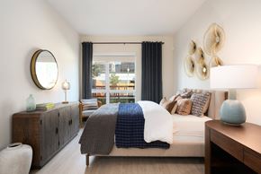 Mountain View apartment for rent - a bedroom with a bed and a dresser and a window