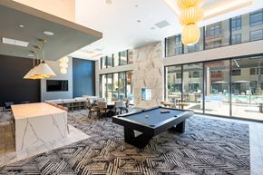 Mountain View apartment for rent - a pool table in the lobby of a building